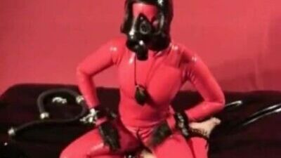 Skinny Rubber Fetish Girl With Red Latex Catsuit And Gasmask Masturbates