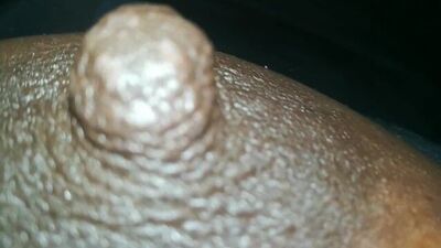 erect ebony nipples close-up