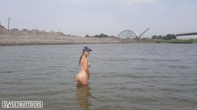 Girl bathes naked in the river and masturbates on the shore